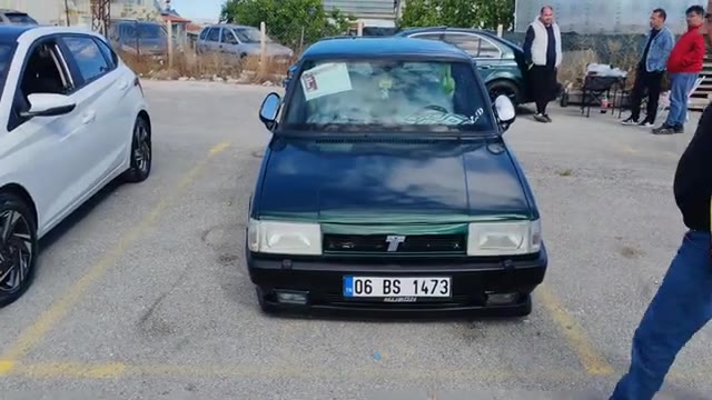 Son olarak, 1993 model siyah bir Kartal SLX, Doğan L jantlarıyla ve